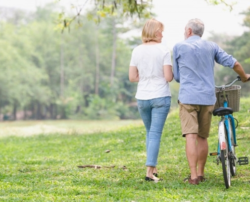 Retired couple walking in the park