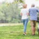 Retired couple walking in the park